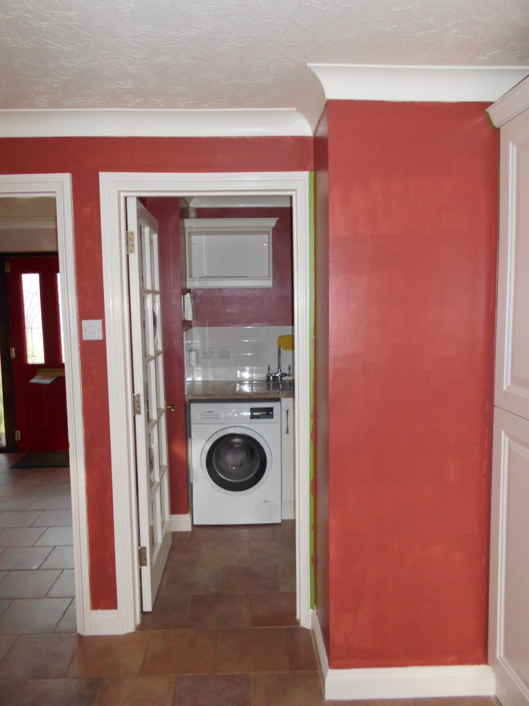 Part painted kitchen with reddish paint