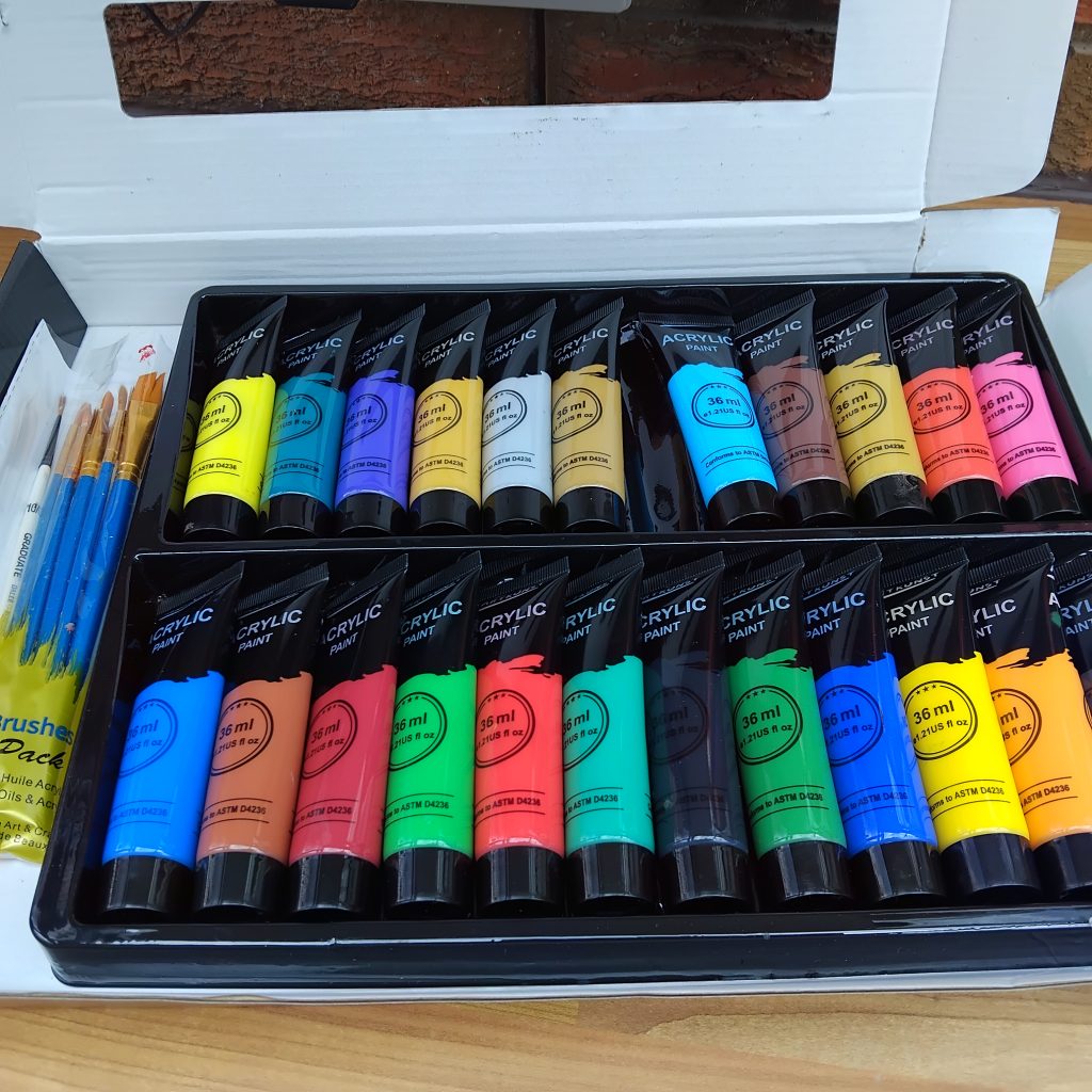 Set of acrylic paints and paintbrushes